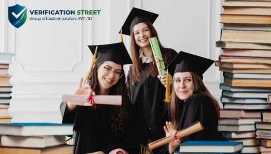 Graduates holding diplomas during a ceremony, representing the importance of Education Background Checks.